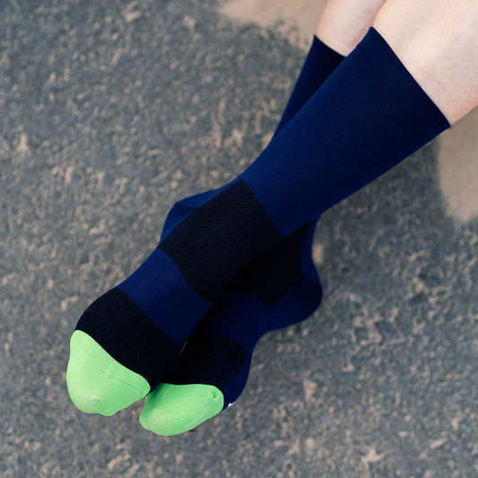 Relaxing without shoes in just dark blue cycling socks