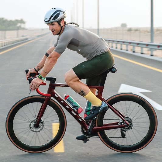 Riders wears Veto Cycling Socks whilst turning on a desert road