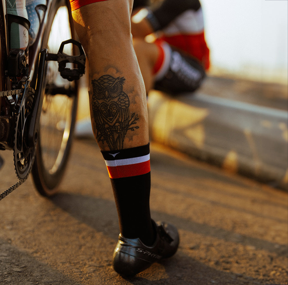 Early morning sun shining on striped Veto Custom Cycling Sock
